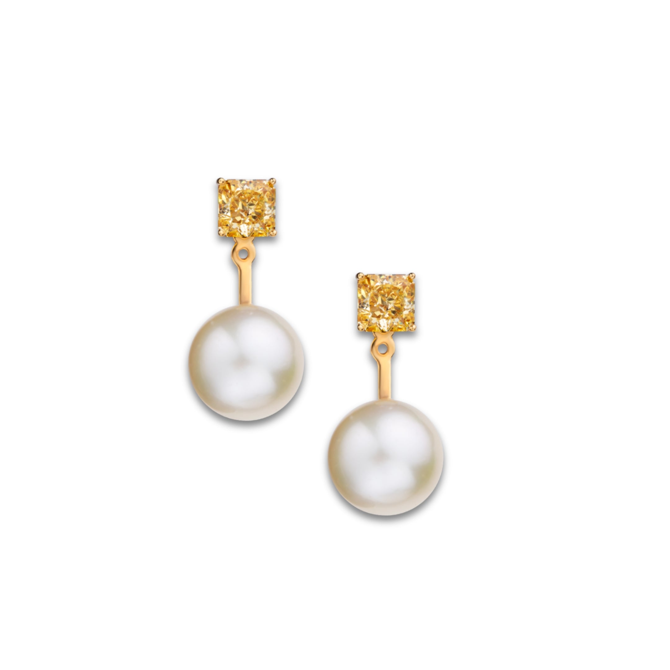The Aurelia Earrings by Just Brilliant, crafted from 18-karat white gold weighing 14.80 grams, feature vibrant 1.5-carat citrines atop each side (totaling 3 carats) and luminous Akoya pearls suspended below, embodying timeless elegance and modern sophistication.