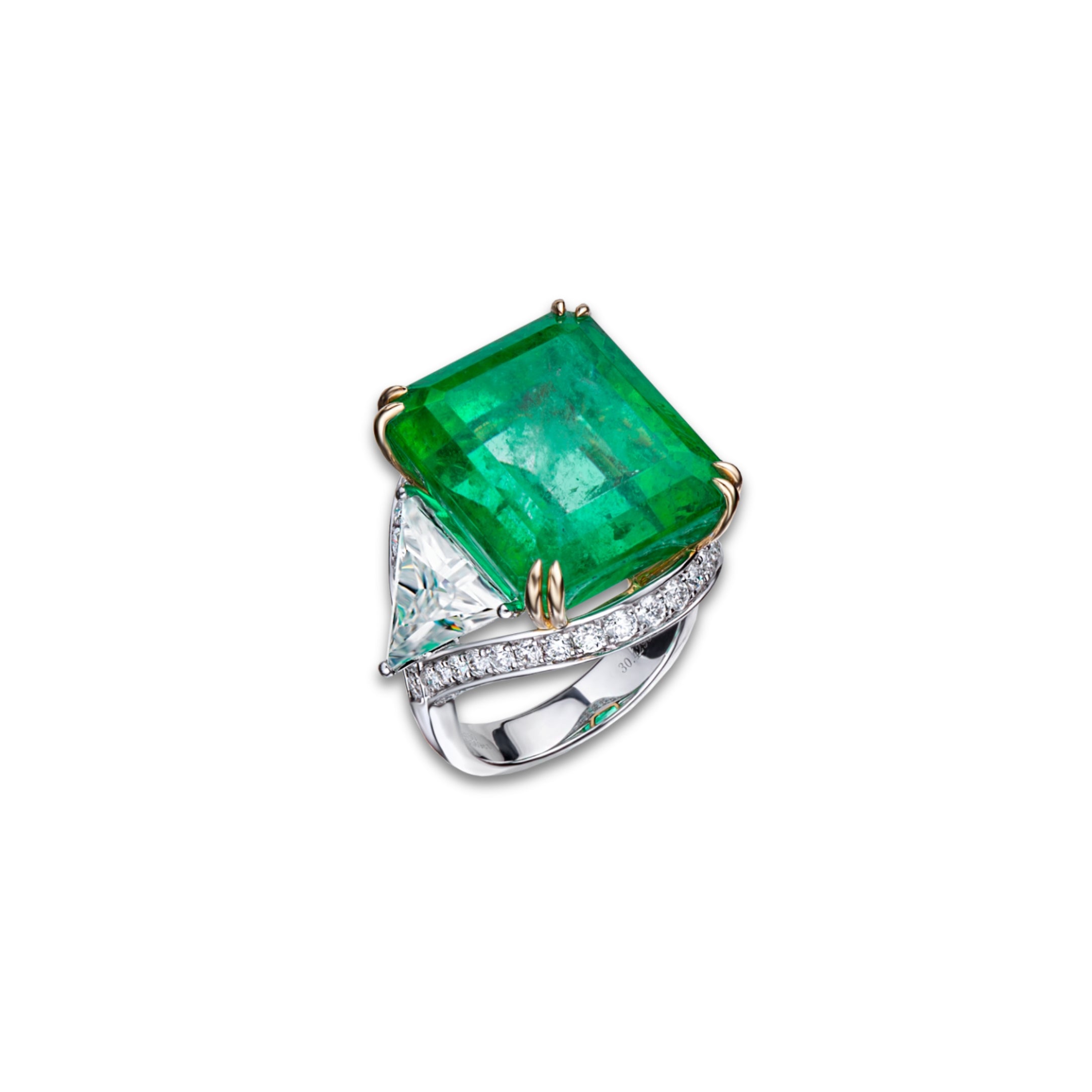 The Elysian Emerald by Just Brilliant – A stunning masterpiece featuring a 30.42-carat natural Colombian emerald, flanked by two triangular lab-created diamonds and a pavé of 10.56 carats of lab-created diamonds. Set in 18K gold, this exceptional ring embodies the perfect fusion of nature’s beauty and exquisite craftsmanship.